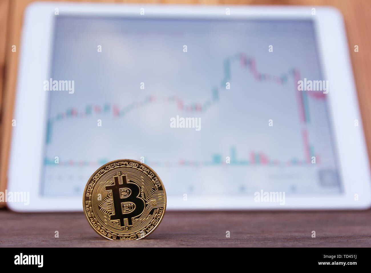 Bitcoin gold coin and candlestick chart background Stock Photo - Alamy