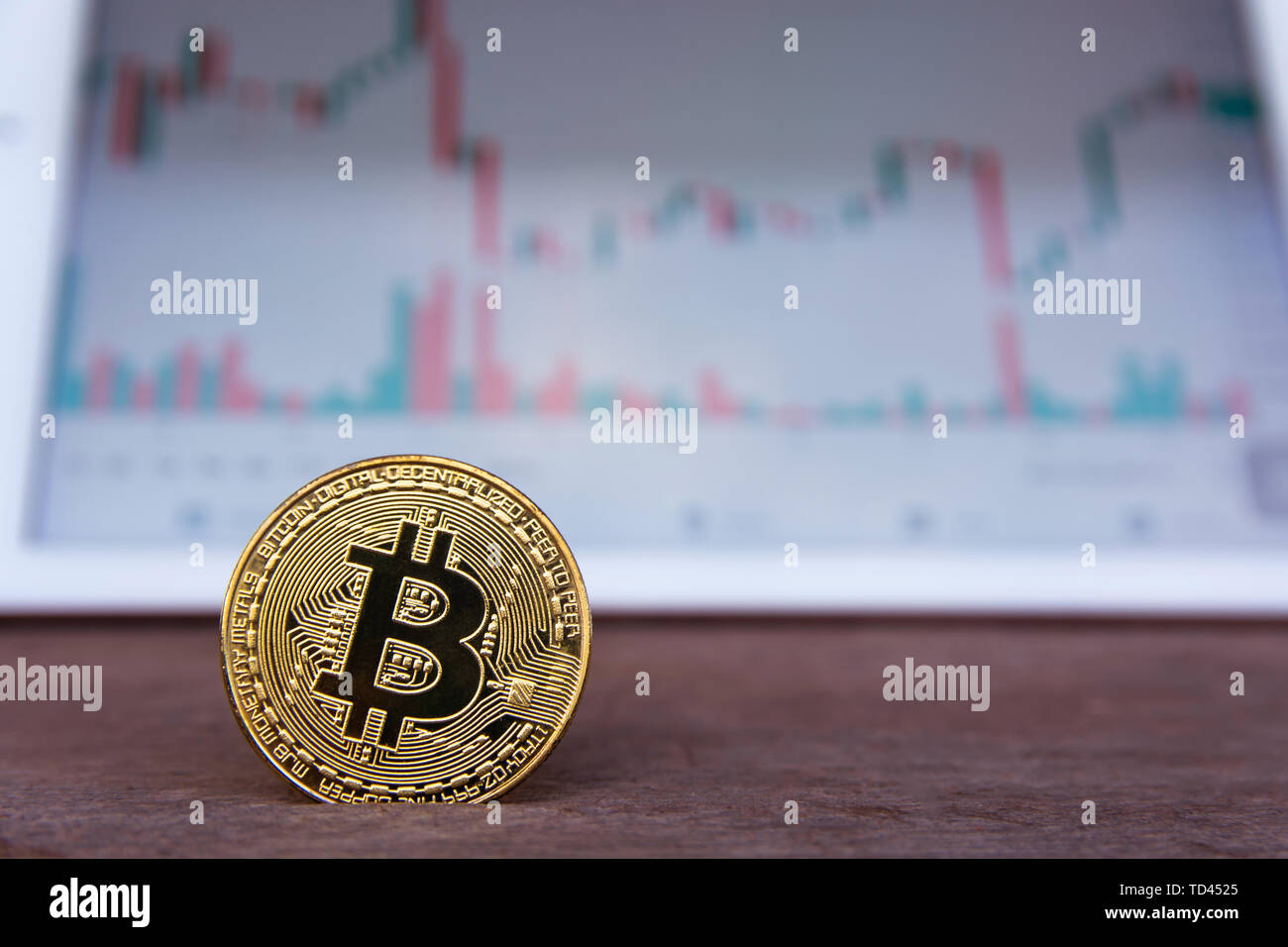 Bitcoin gold coin and candlestick chart background Stock Photo - Alamy