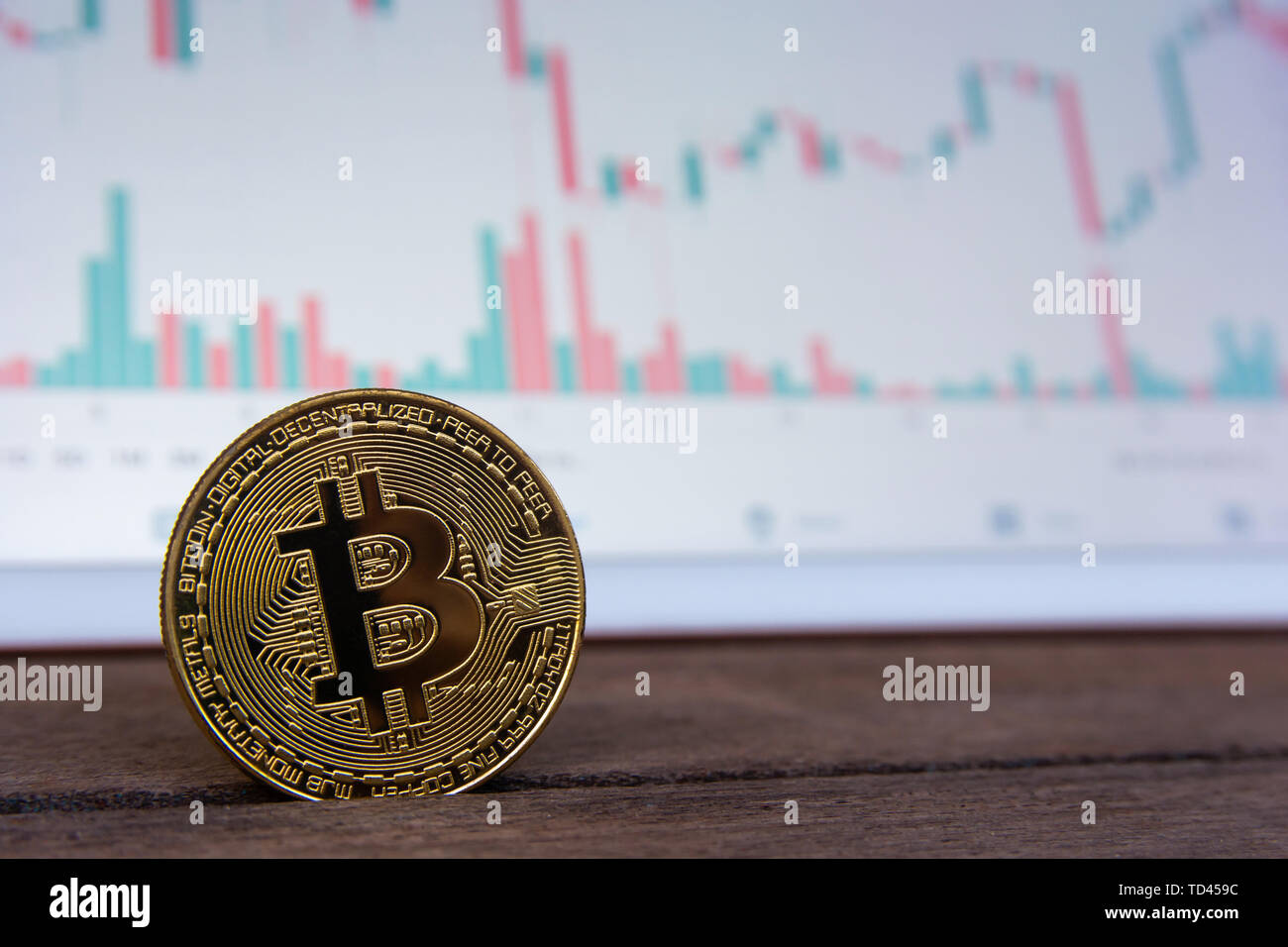 Bitcoin gold coin and candlestick chart background Stock Photo - Alamy