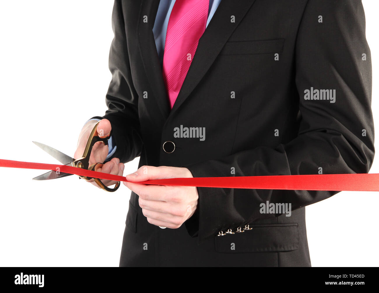 Man's hand cutting red ribbon with pair of scissors for ceremony isolated on white Stock Photo