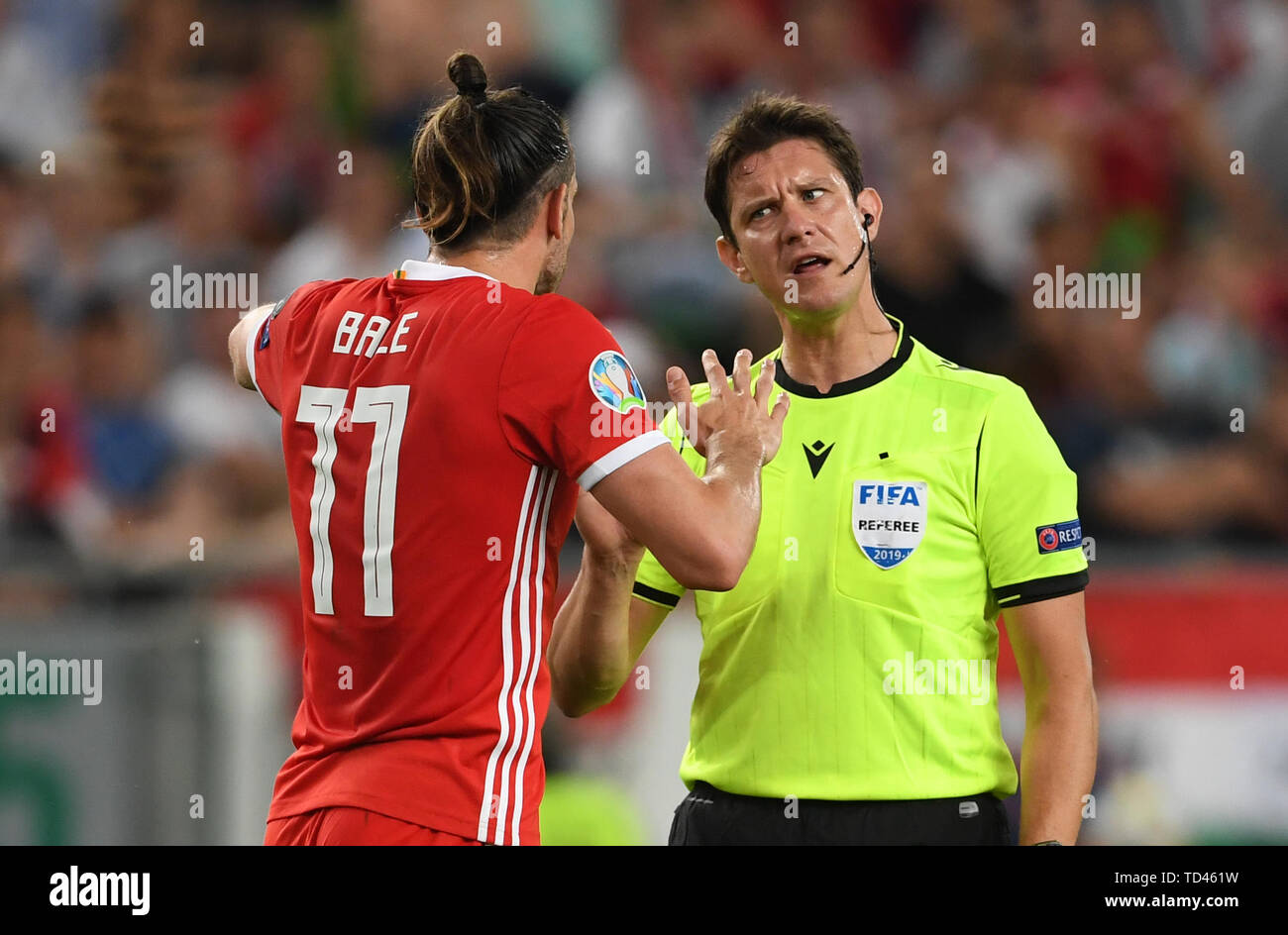 Wales' Gareth Bale speaks with referee Matej Jug during the UEFA Euro 2020  Qualifying, Group E match at the Groupama Arena, Budapest Stock Photo -  Alamy