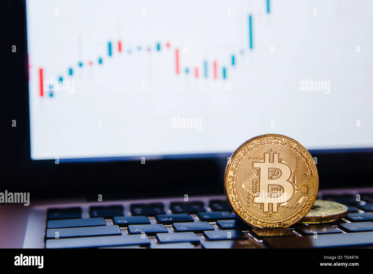 Golden Bitcoin On Keyboard Laptop With Forex Trading Graph - 