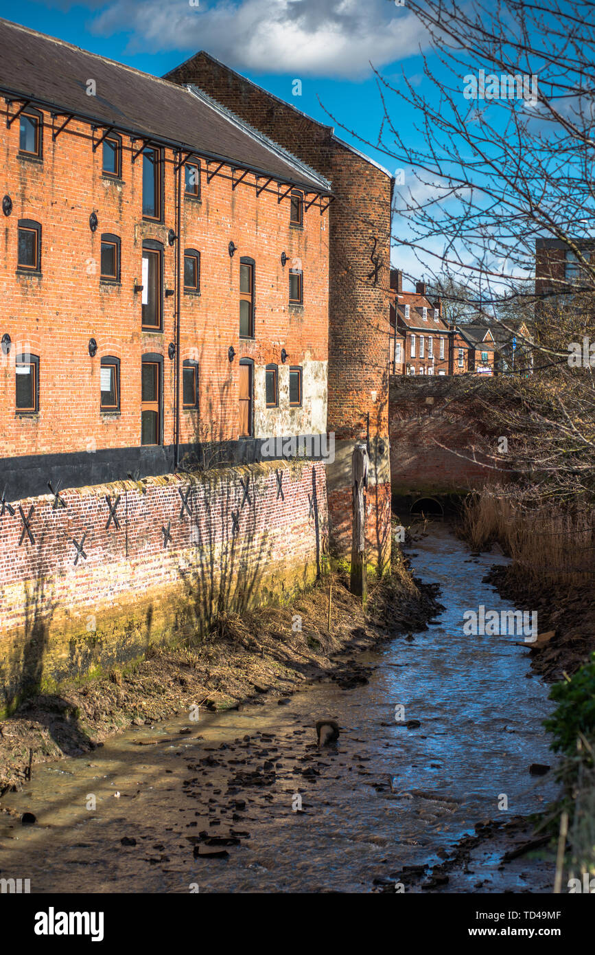 Victorian warehouses on river tributary in Kings Lynn, Norfolk, England, United Kingdom, Europe Stock Photo