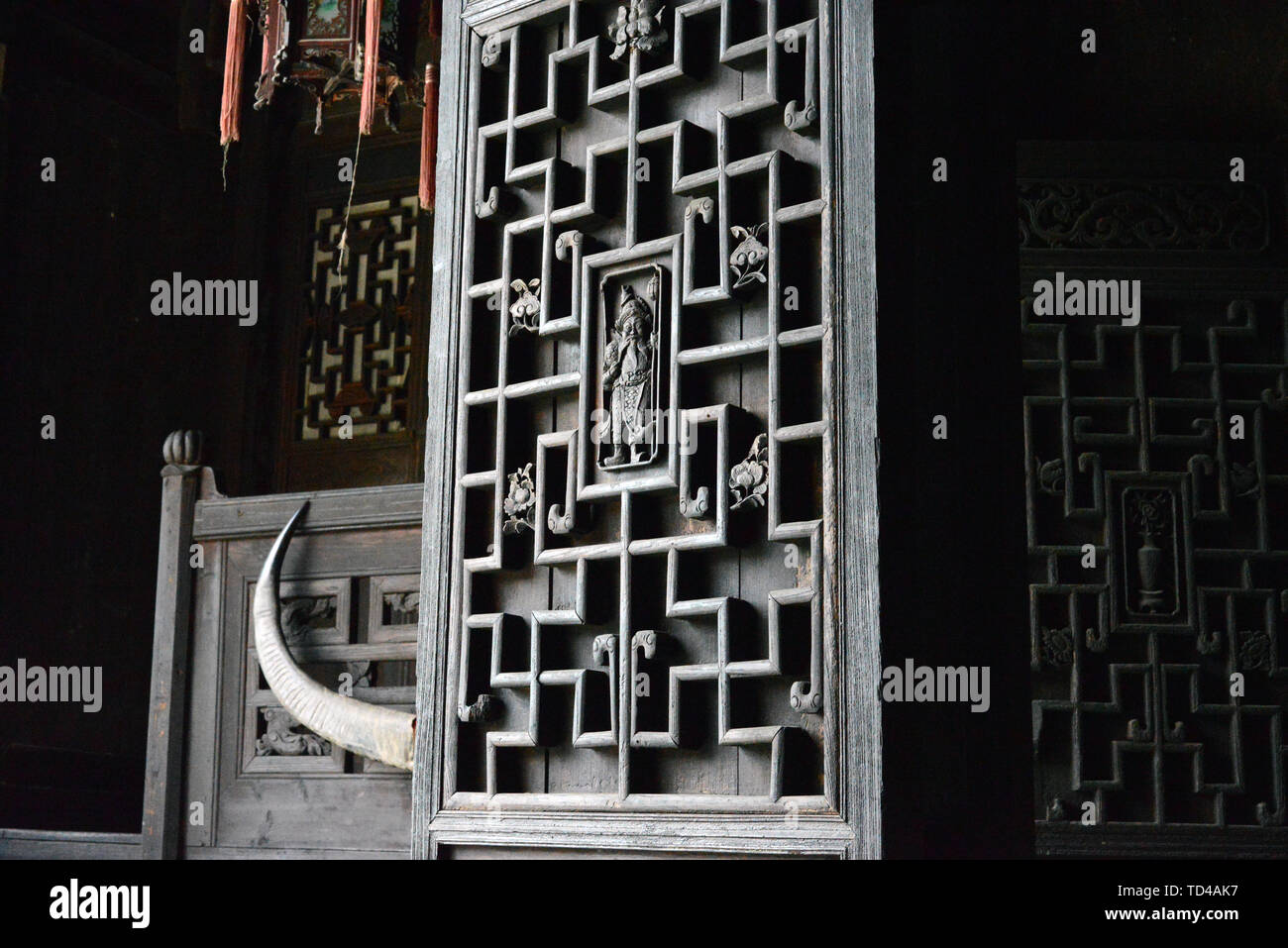 Classical Tujia residential building wood carved doors and windows decoration Stock Photo