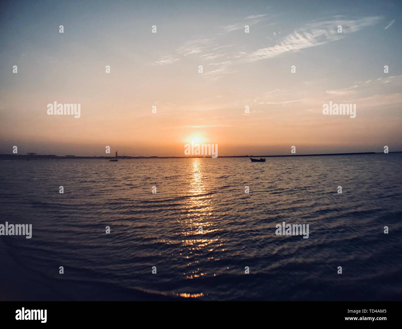 Sun Setting Low The setting sun, low tide and high tide on the sea have different ...