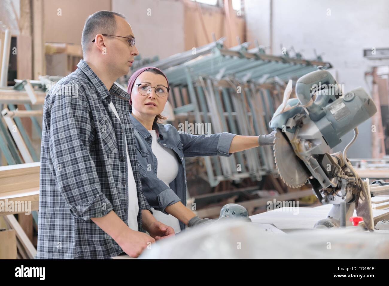 Industrial portrait of working men and women, people talking at work