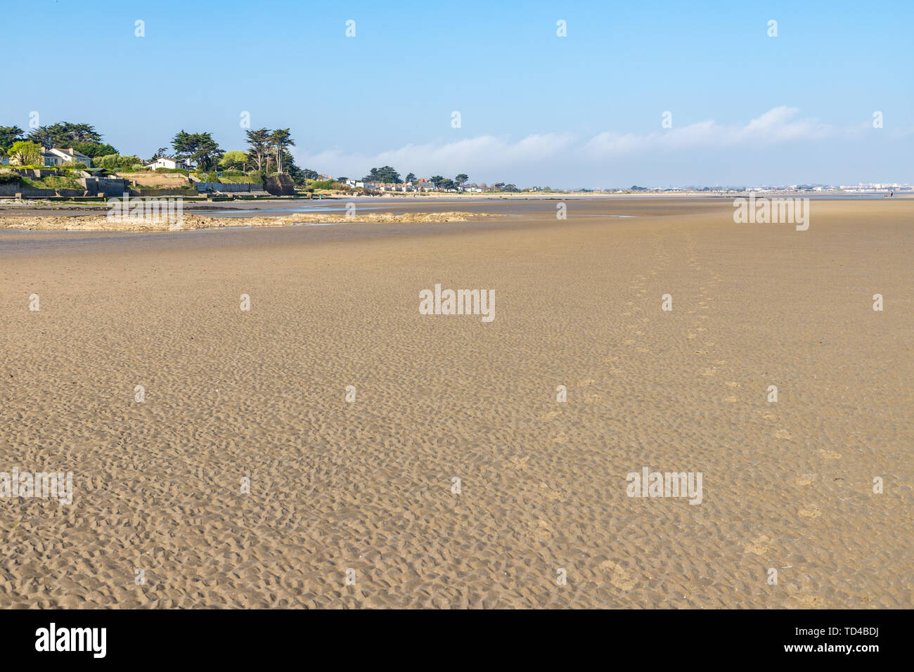 Houses and sand in Burrow beach, Sutton, Dublin, Ireland Stock Photo