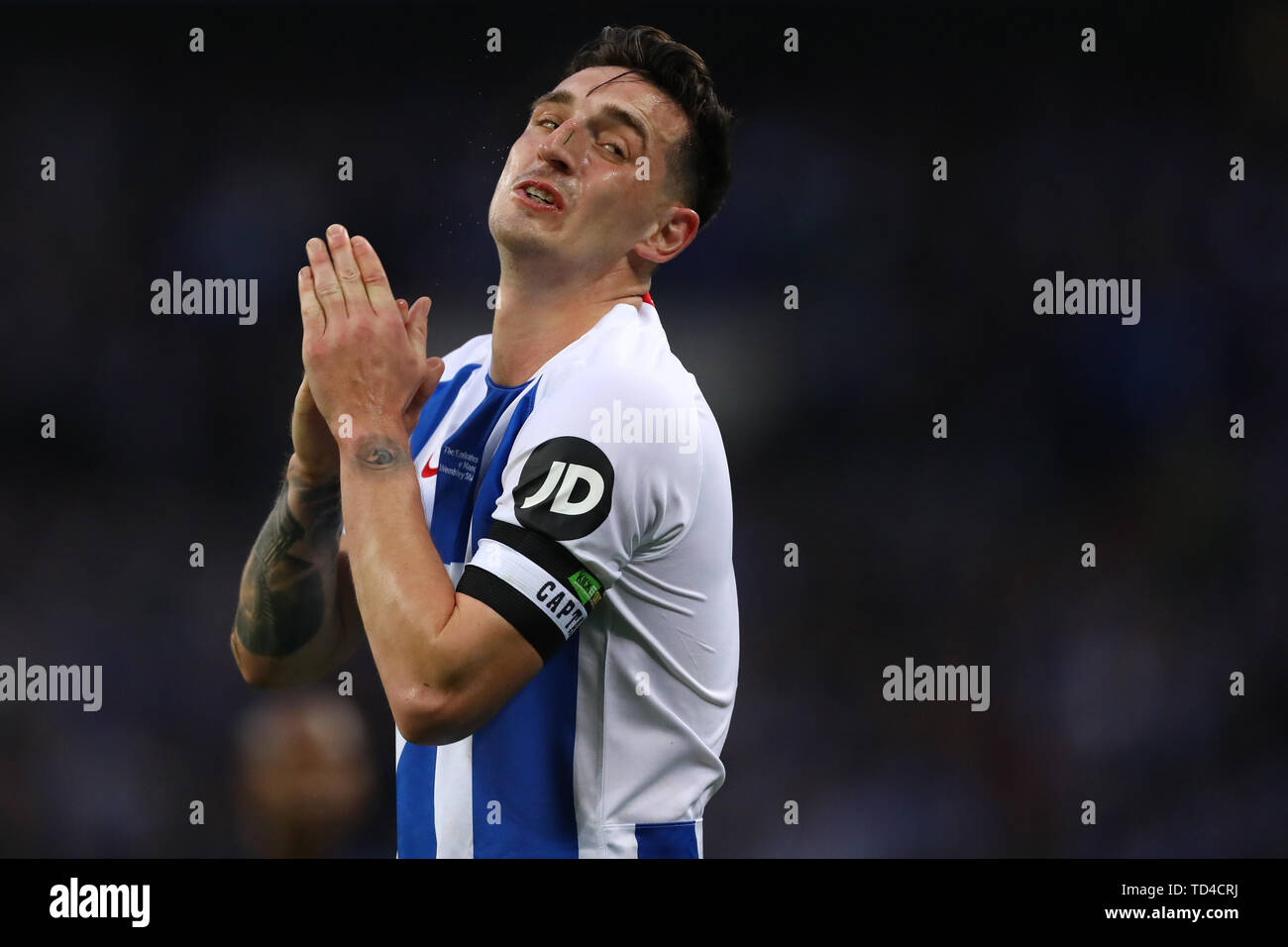 A dejected Lewis Dunk of Brighton & Hove Albion at the final whistle after being knocked out to Manchester City - Manchester City v Brighton & Hove Albion, The Emirates FA Cup Semi Final, Wembley Stadium, London - 6th April 2019  Editorial Use Only Stock Photo