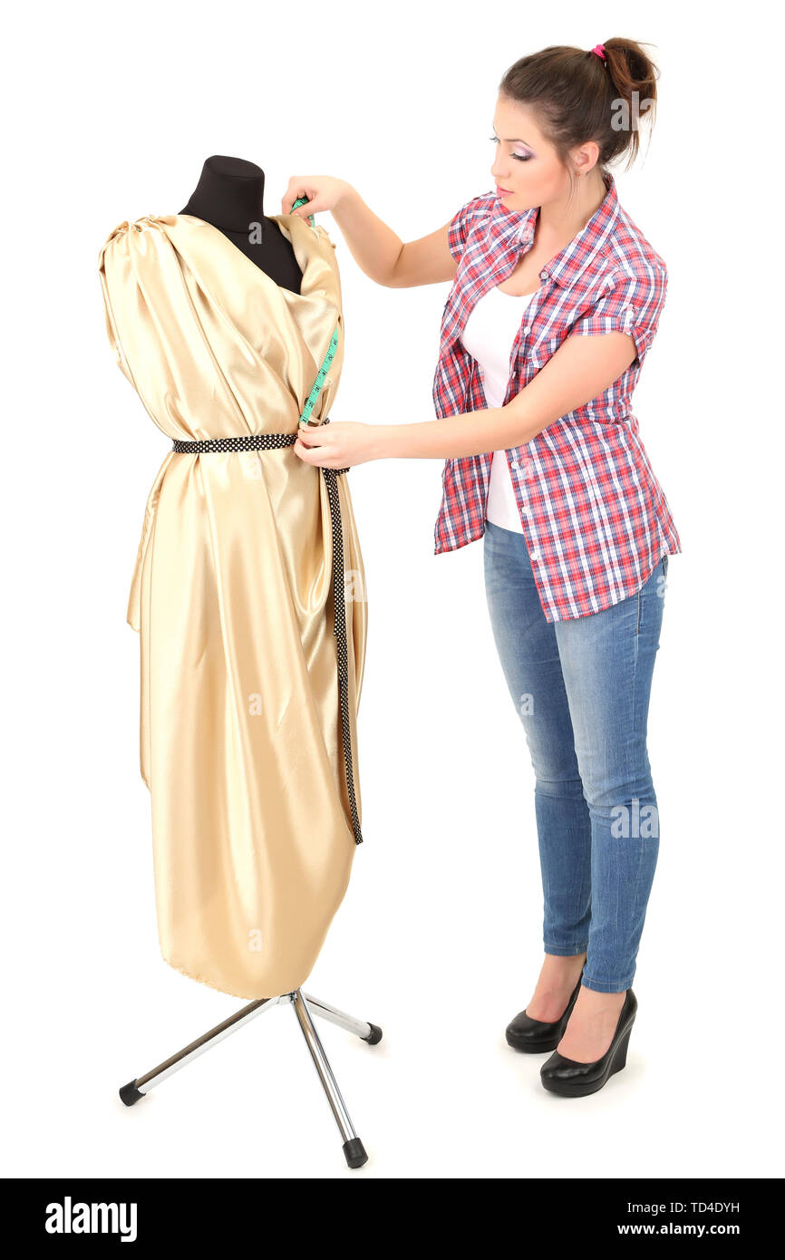 Beautiful young dressmaker and mannequin isolated on white Stock Photo