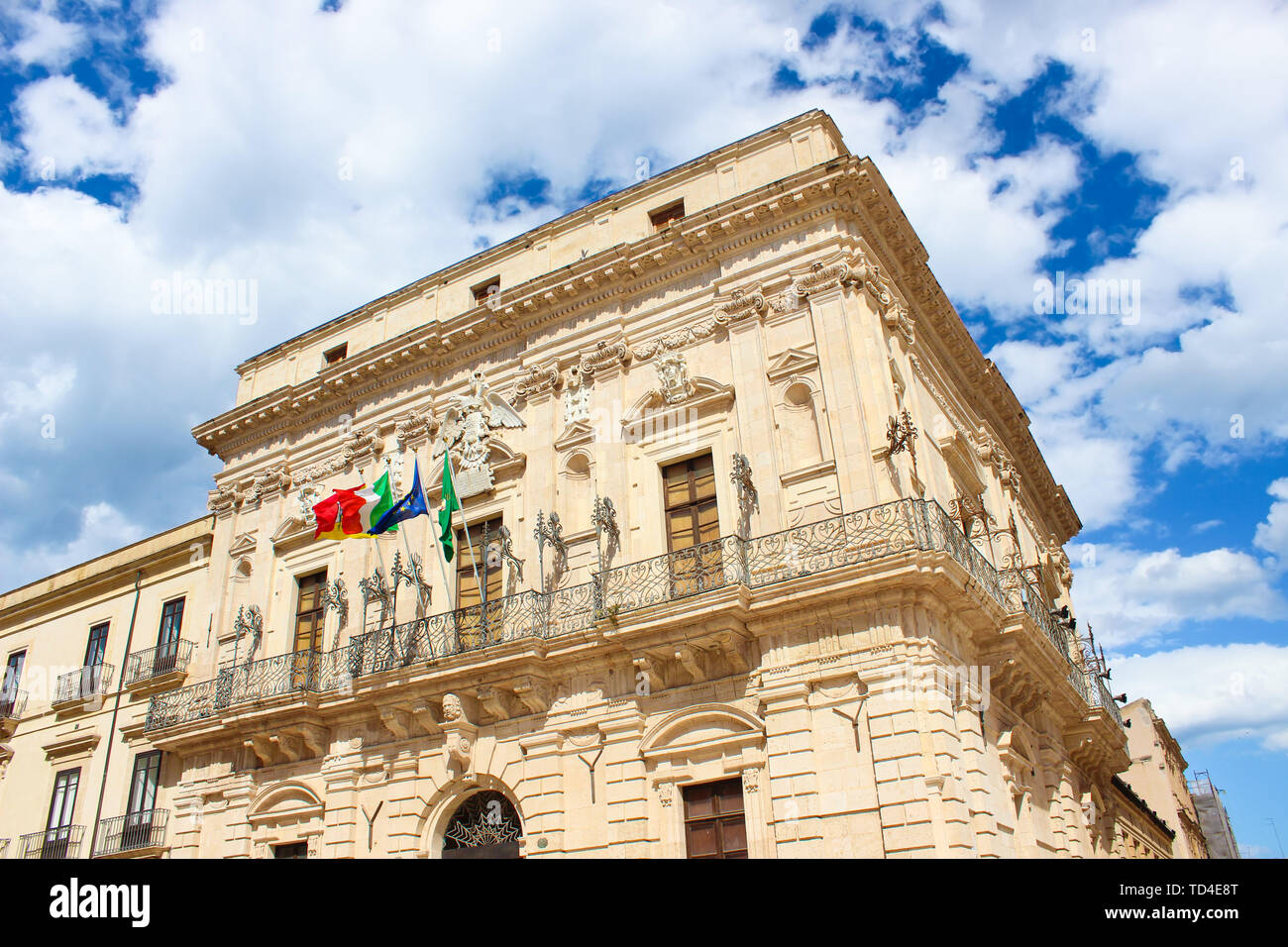 Detail of beautiful Vermexio Palace in Syracuse, Sicily, Italy. The historical building serves nowadays as a town hall. Located on famous Ortygia Island close to Syracuse Cathedral. Popular site. Stock Photo