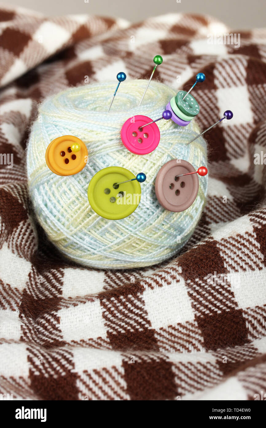 Ball of thread in the buttons Stock Photo - Alamy