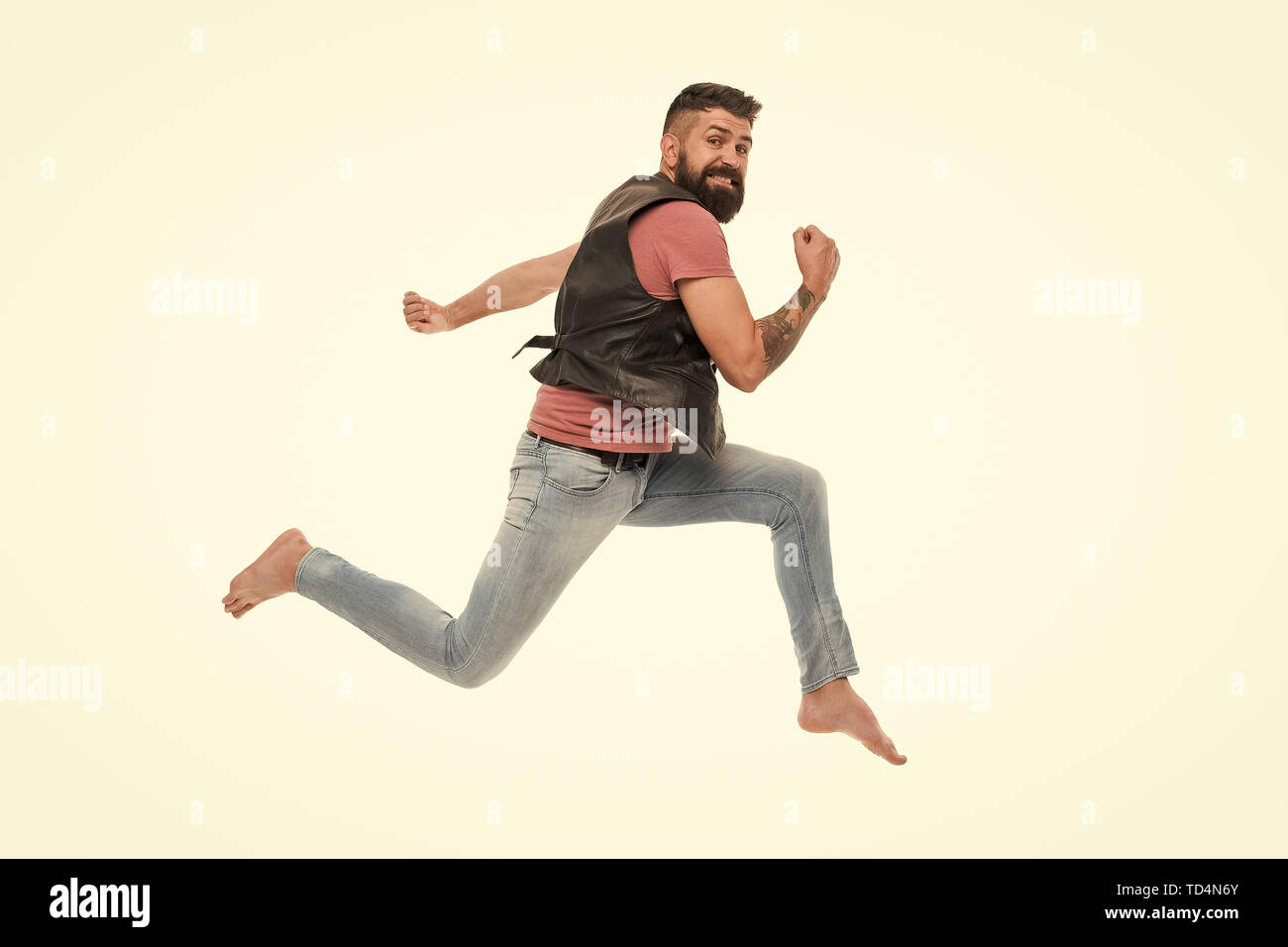 Never stop. Man thief run away. Keep moving concept. Guy bearded hipster captured in running motion isolated on white background. Bearded man running high speed. Escape and runaway. Running motion. Stock Photo