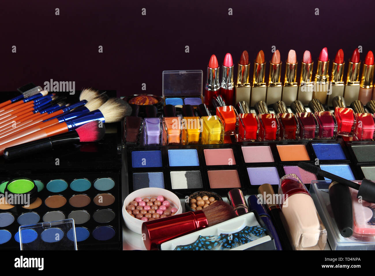 Lot of different cosmetics on purple background Stock Photo