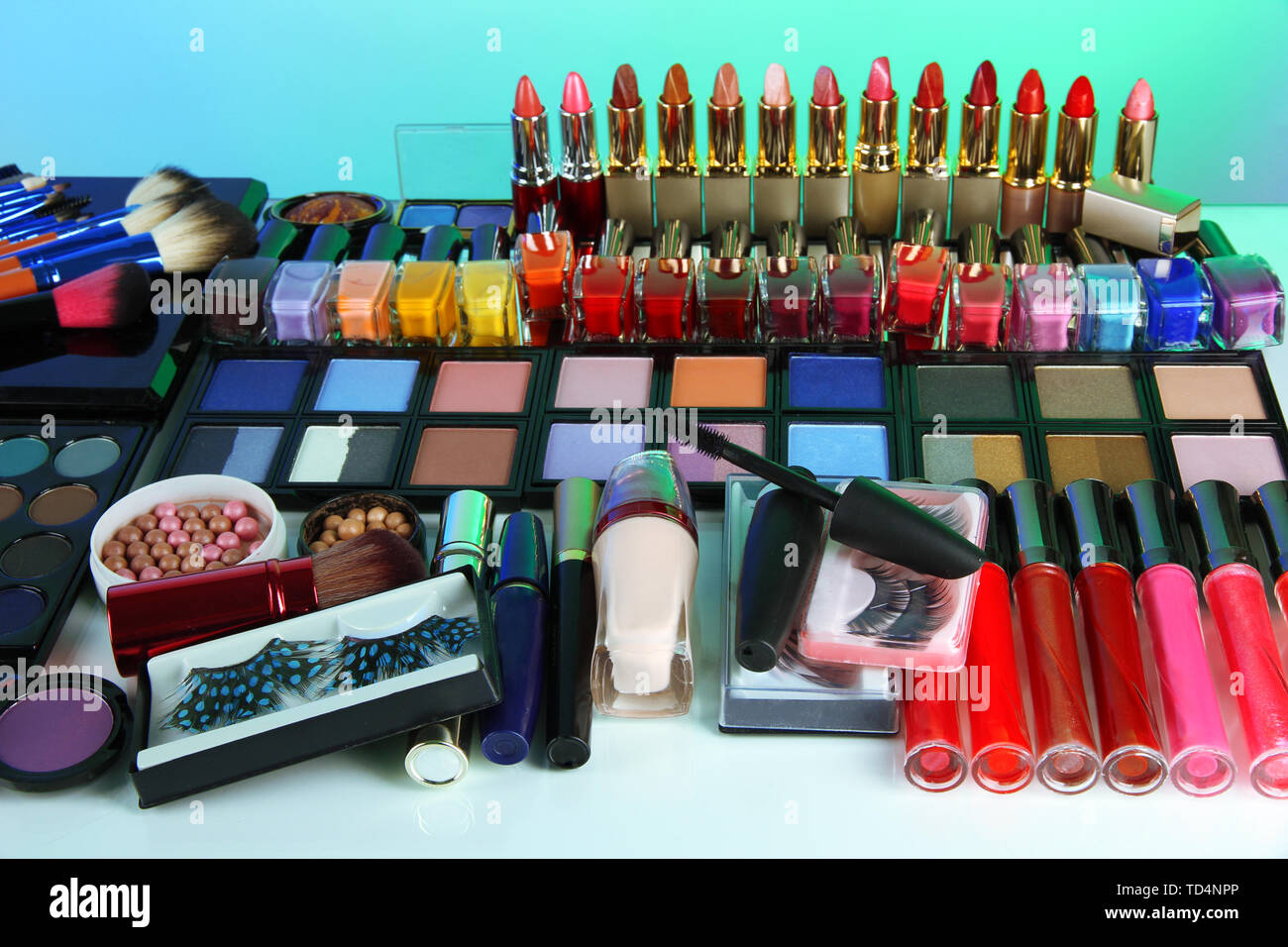 Lot of different cosmetics on blue background Stock Photo