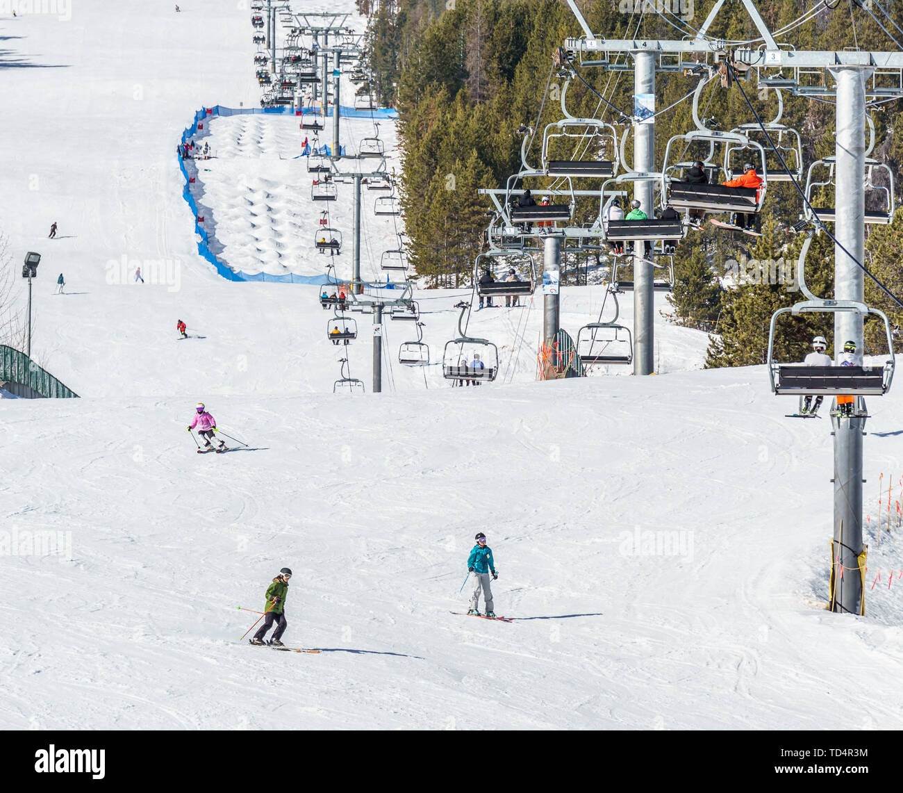 KIMBERLEY, CANADA - MARCH 22, 2019: Mountain Resort view early spring people skiing. Stock Photo
