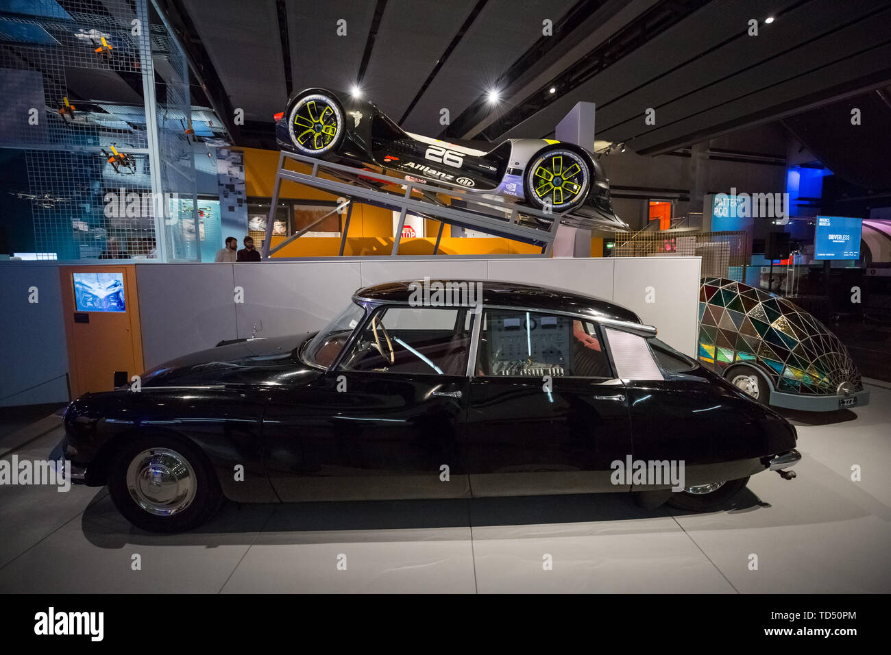 London, UK. 12th June 2019. Driverless technology 'Who is in control?' exhibition is launched the Science Museum. Pictured(bottom): Citroen DS19, 1960, an early prototype example of British self-driving technology. Pictured (top): 'Robocar' the world's first self-driving rally car, fully electric and developed by Roborace. Exploring the history of self-driving vehicles, the exhibition also examines how much control we're willing to transfer to them and how their wider deployment could shape out habits, behaviour and society. Credit: Guy Corbishley/Alamy Live News Stock Photo