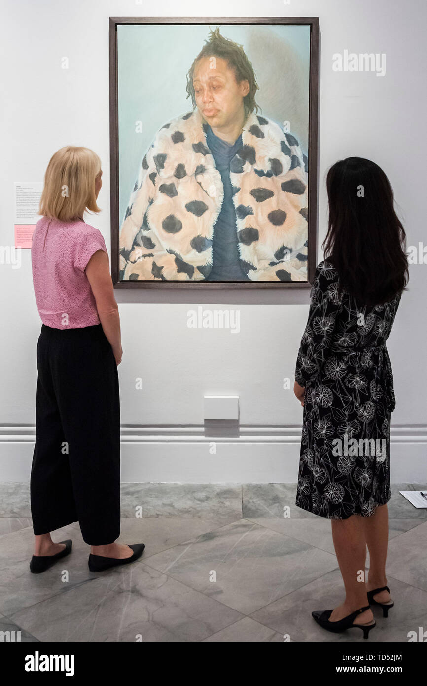 London, UK. 12th June, 2019. Charlie Schaffer's Imara in her Winter Coat, a portrait of his close friend - The winner of the BP Portrait Award 2019 at the National Portrait Gallery, London. Credit: Guy Bell/Alamy Live News Stock Photo