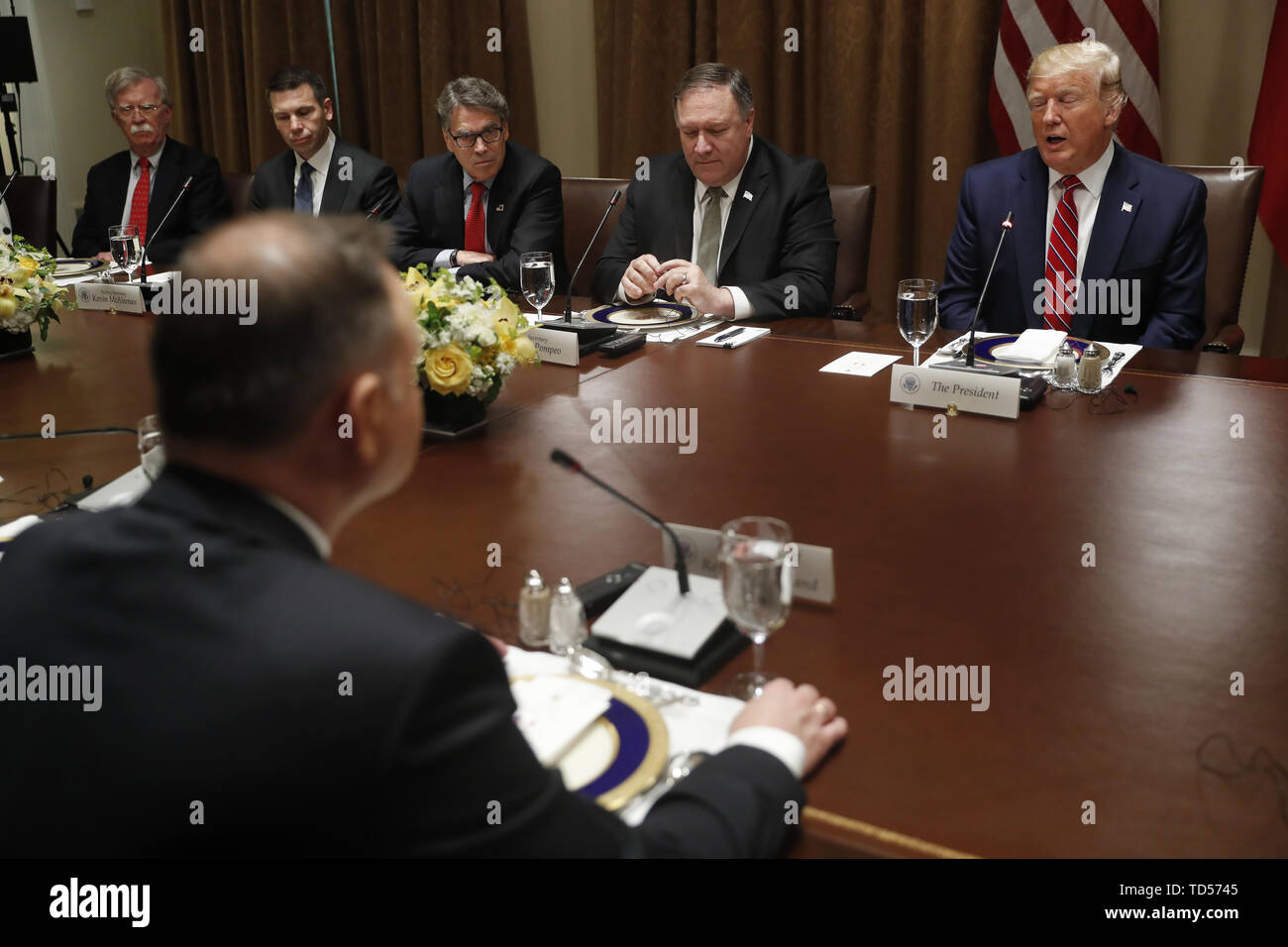 Polish President Andrzej Duda (B) and (L-R) US National Security Advisor John, Bolton, Acting US Secretary of Homeland Security Kevin McAleenan, US Secretary of Energy Rick Perry, US Secretary of State Mike Pompeo and US President Donald J. Trump during a luncheon in the cabinet room of the White House in Washington, DC, USA, 12 June 2019. Later in the day President Trump and President Duda will participate in a signing ceremony to increase military to military cooperation including the purchase of F-35 fighter jets and an increased US troop presence in Poland. Credit: Shawn Thew/Pool via Stock Photo