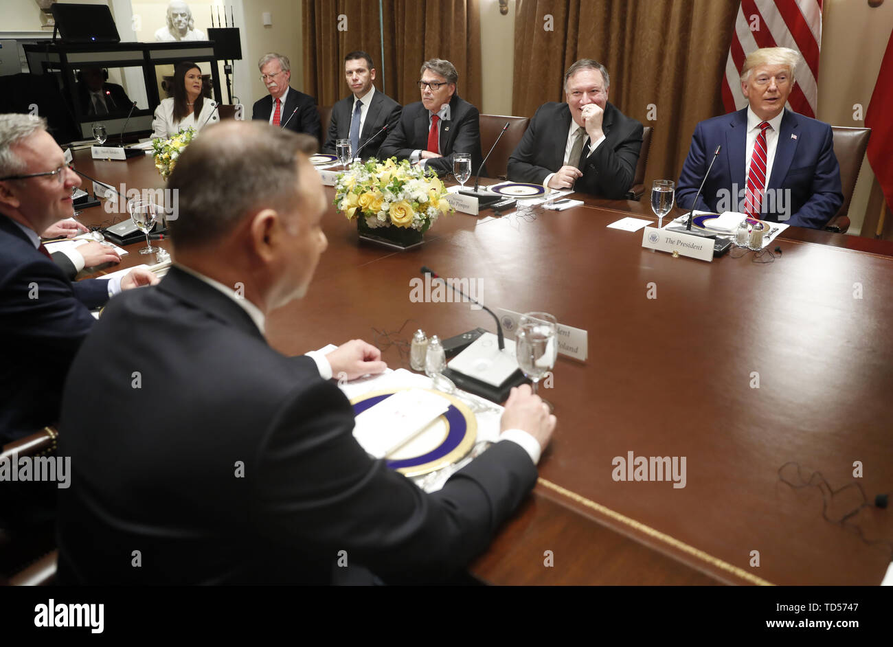 Polish President Andrzej Duda (B) and (far side L-R) White House Press Secretary Sarah Sanders, US National Security Advisor John Bolton, Acting US Secretary of Homeland Security Kevin McAleenan, US Secretary of Energy Rick Perry, US Secretary of State Mike Pompeo and US President Donald J. Trump during a luncheon in the cabinet room of the White House in Washington, DC, USA, 12 June 2019. Later in the day President Trump and President Duda will participate in a signing ceremony to increase military to military cooperation including the purchase of F-35 fighter jets and an increased US troop Stock Photo
