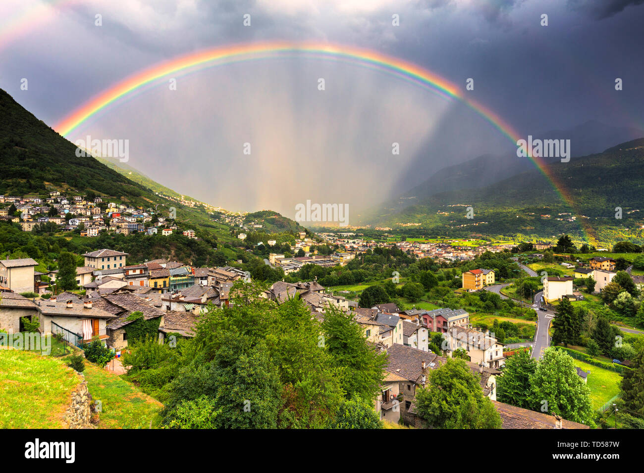 Rainbow above the valley, Valtellina, Lombardy, Italy, Europe Stock Photo