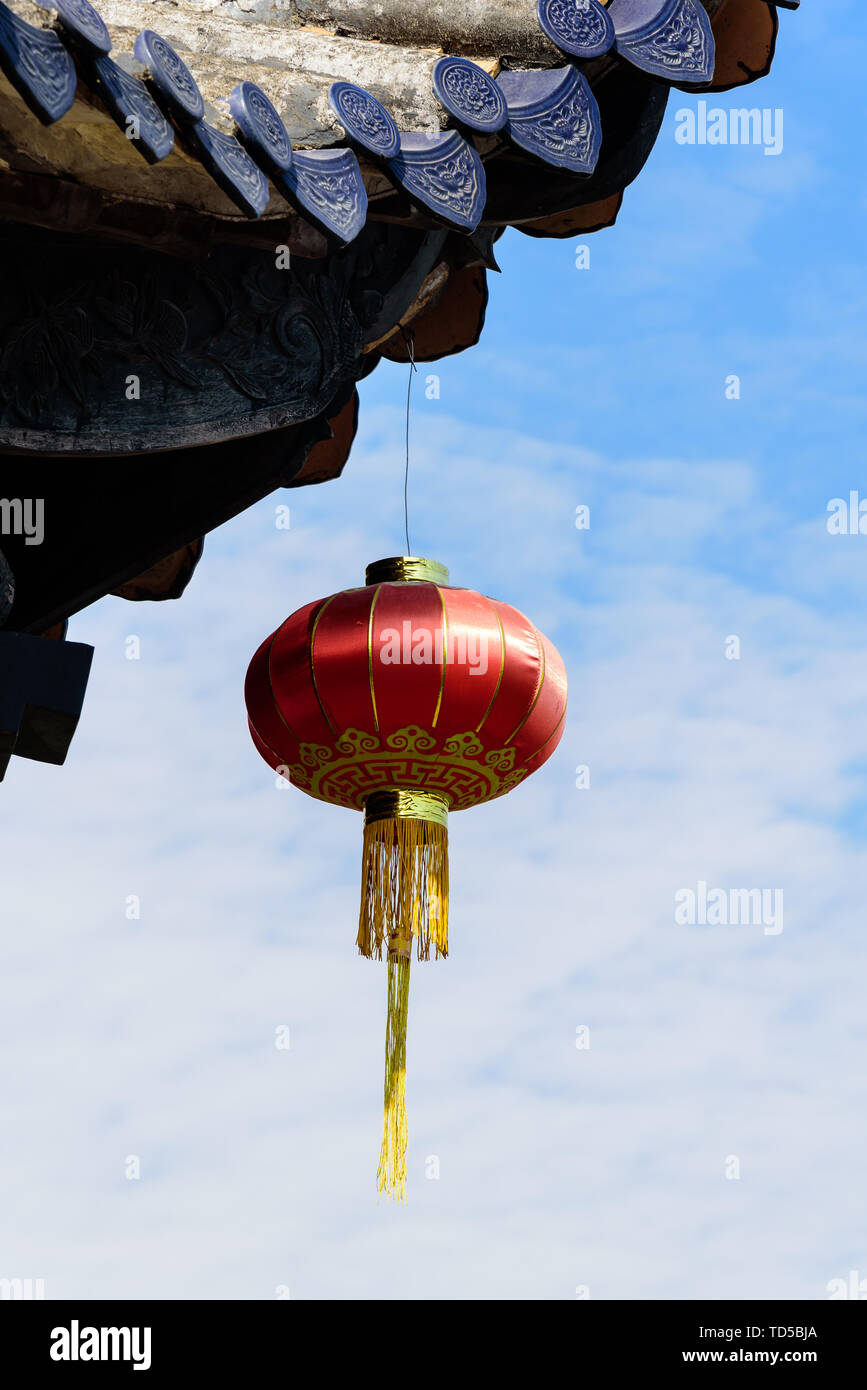 Red lanterns under the eaves Stock Photo - Alamy