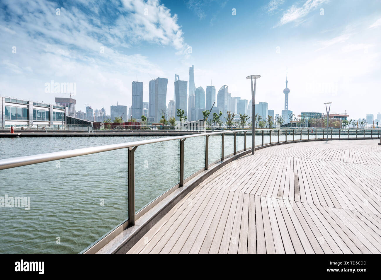 empty wooden road waterside and modern buildings Stock Photo - Alamy