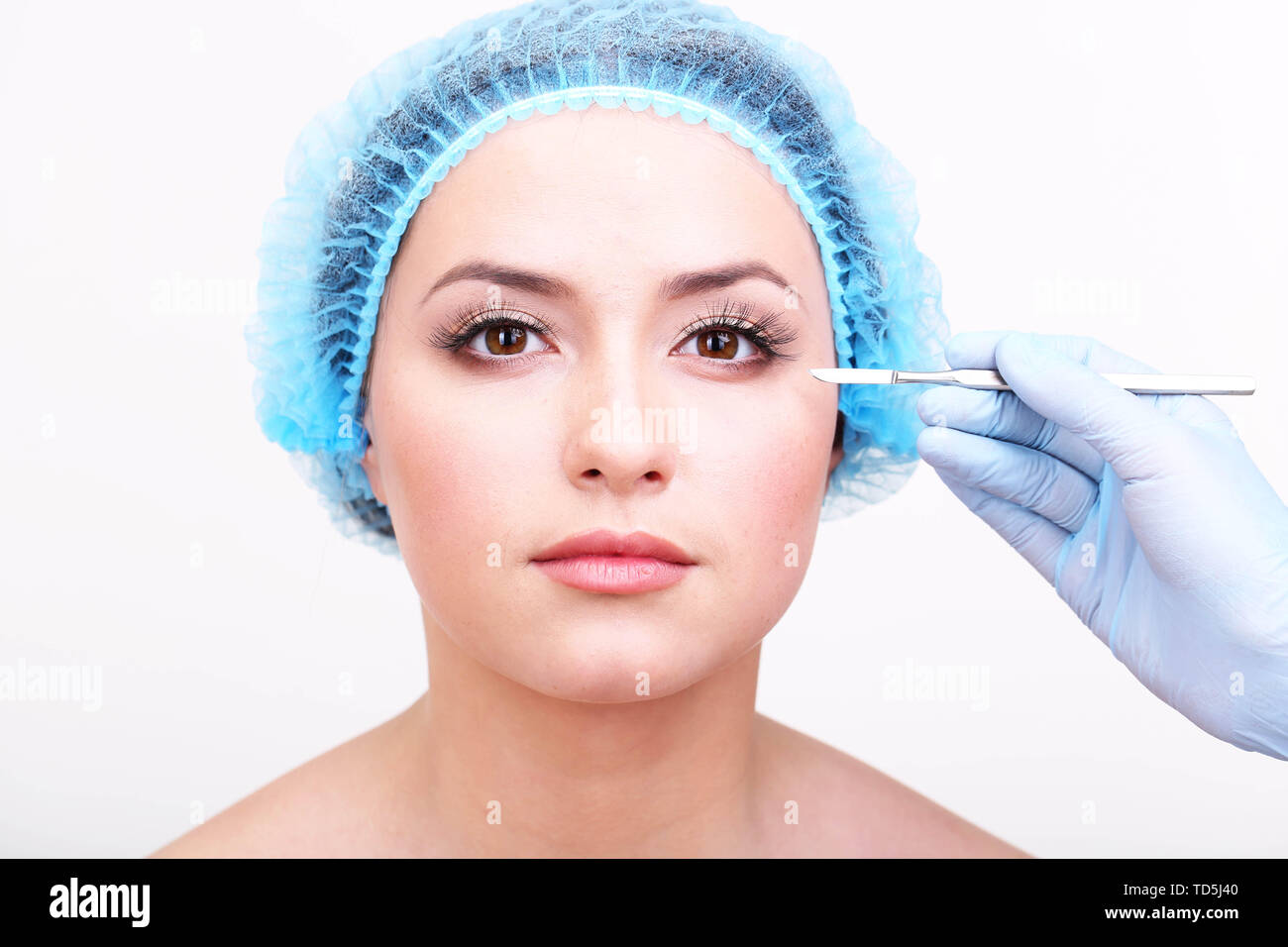 Cosmetic surgery with scalpel on young woman close up Stock Photo Alamy