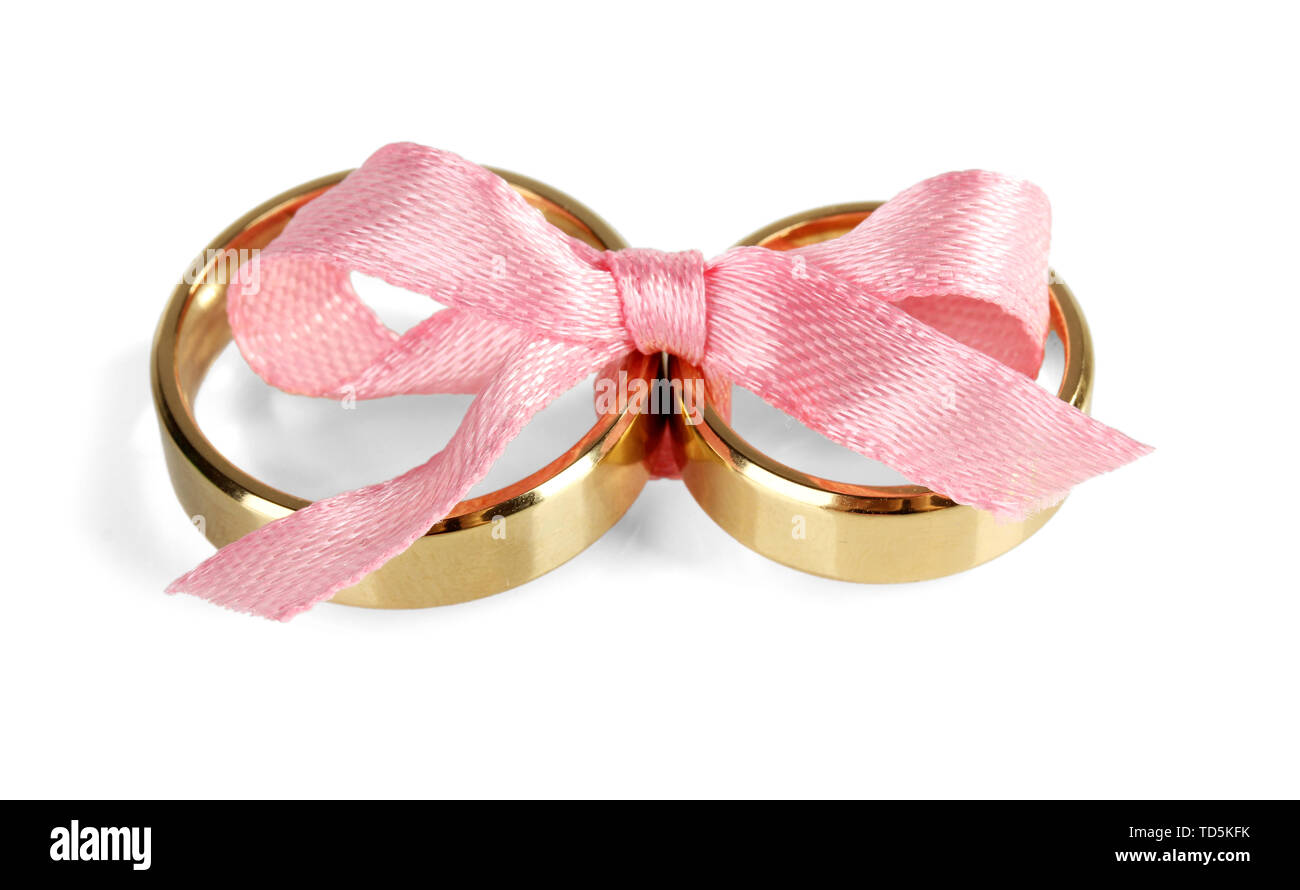 Wedding rings tied with ribbon isolated on white Stock Photo - Alamy