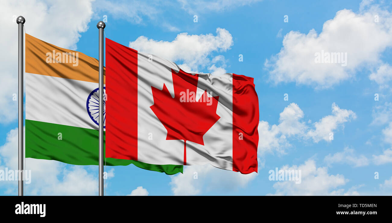 India and Canada flag waving in the wind against white cloudy blue sky  together. Diplomacy concept, international relations Stock Photo - Alamy