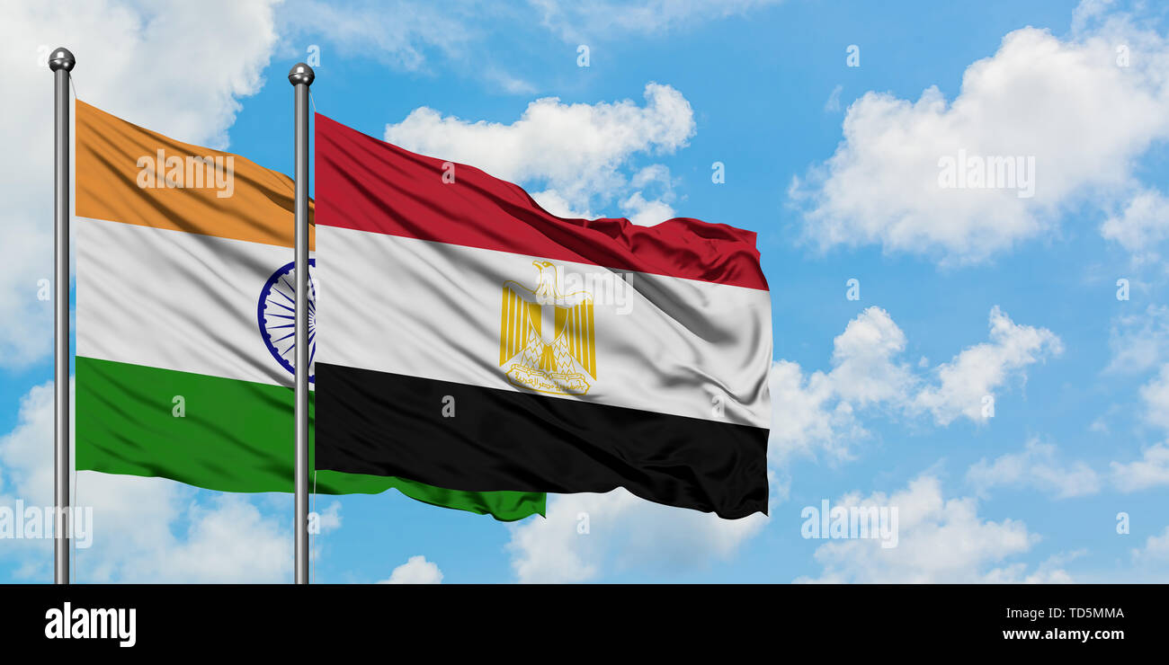 India and Egypt flag waving in the wind against white cloudy blue sky together. Diplomacy concept, international relations. Stock Photo