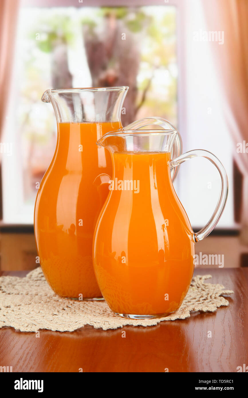 https://c8.alamy.com/comp/TD5RC1/orange-juice-in-pitchers-on-table-in-room-TD5RC1.jpg