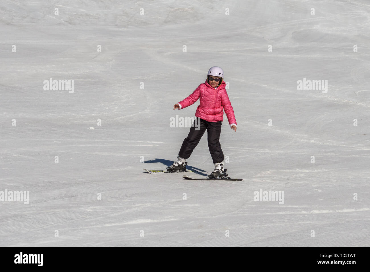 KIMBERLEY, CANADA - MARCH 22, 2019: Mountain Resort view early spring child skiing. Stock Photo