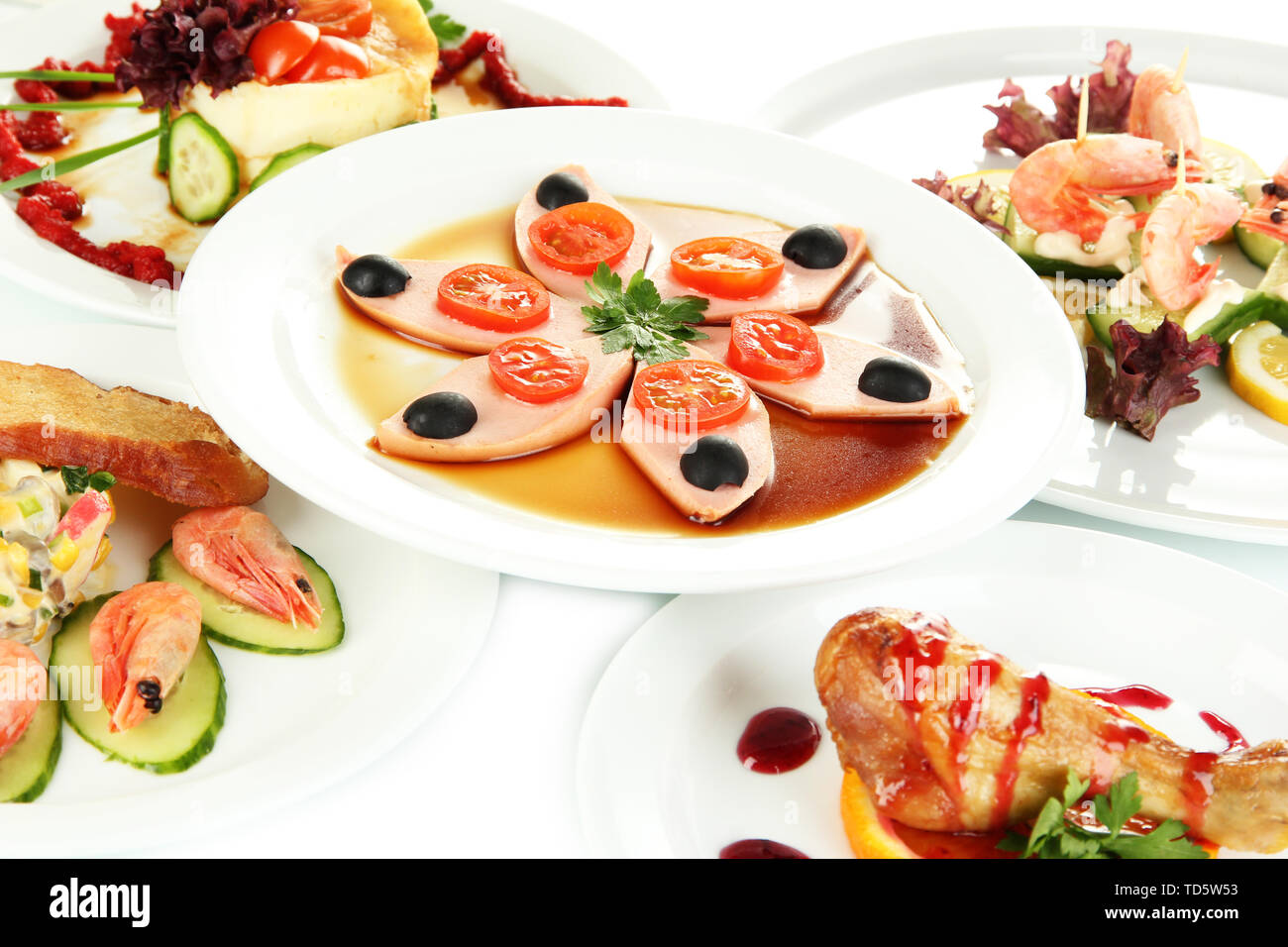 Small portions of food on big white plates close up Stock Photo - Alamy