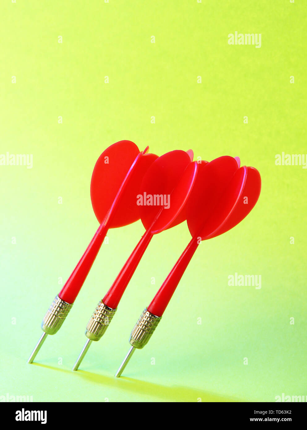 Darts on green background Stock Photo Alamy