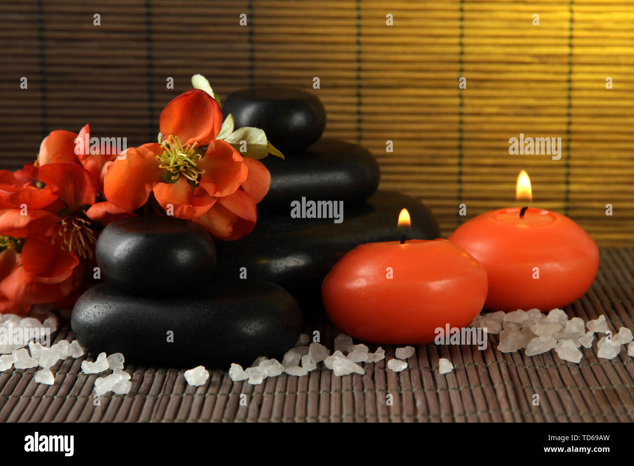 Spa stones with flowers and candles on bamboo background Stock Photo ...