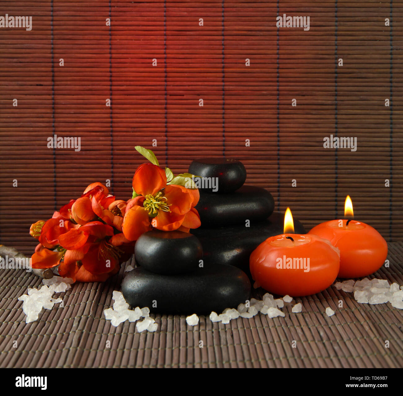Spa stones with flowers and candles on bamboo background Stock Photo ...