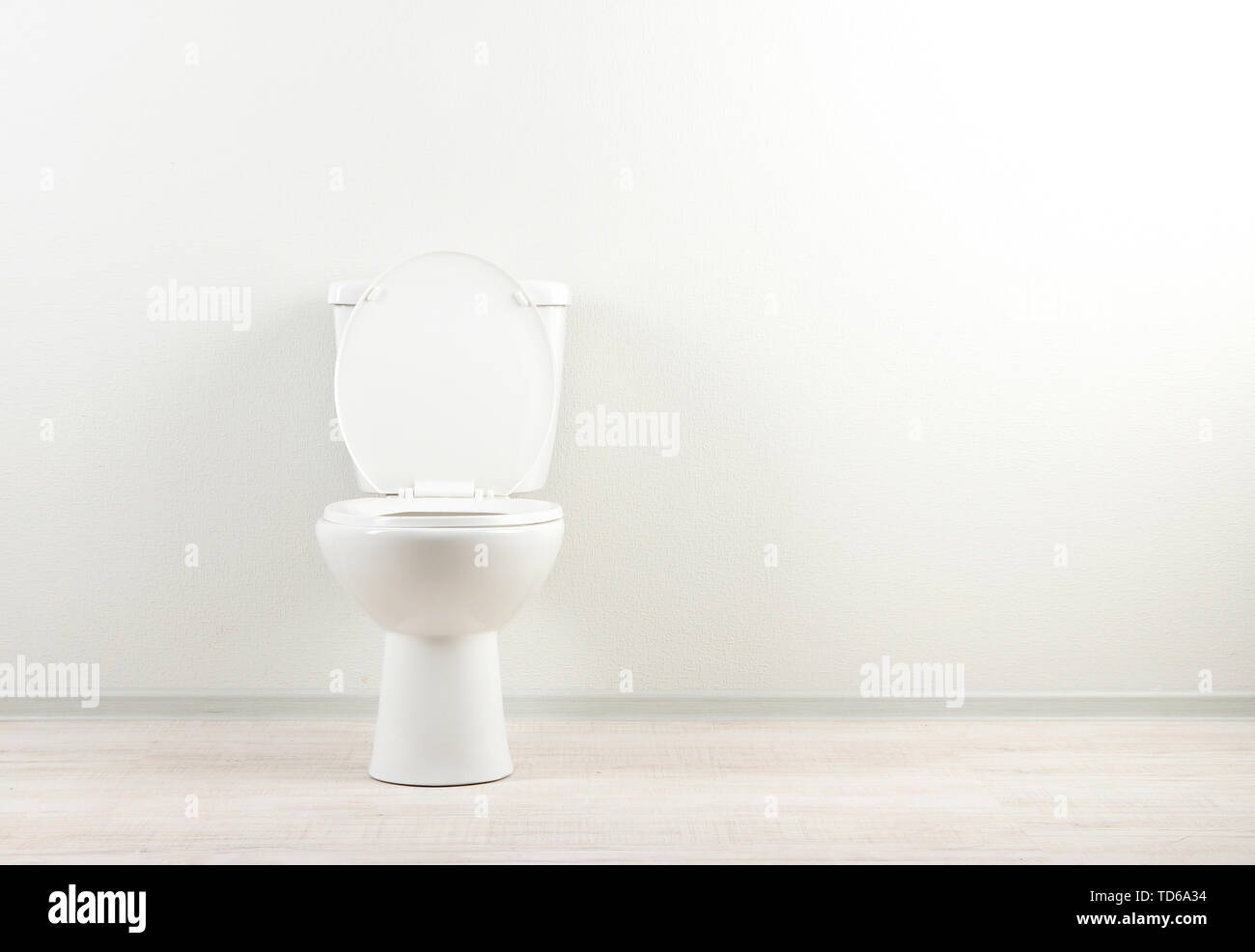 White toilet bowl in a bathroom Stock Photo - Alamy