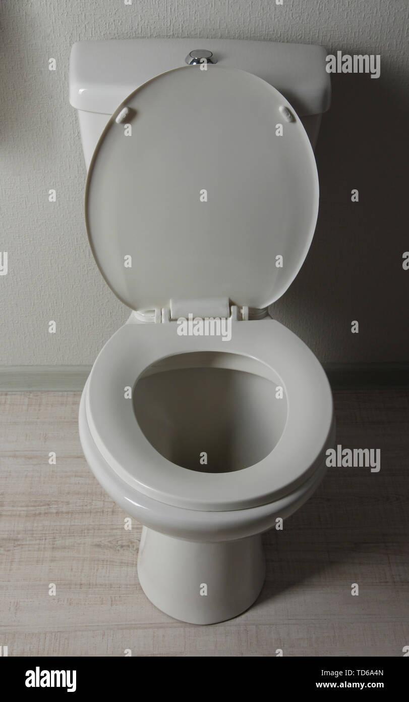 White toilet bowl in a bathroom Stock Photo - Alamy