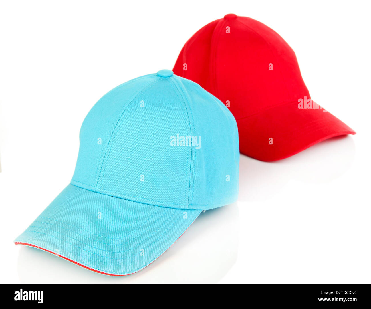 Red and blue caps cap isolated on white Stock Photo