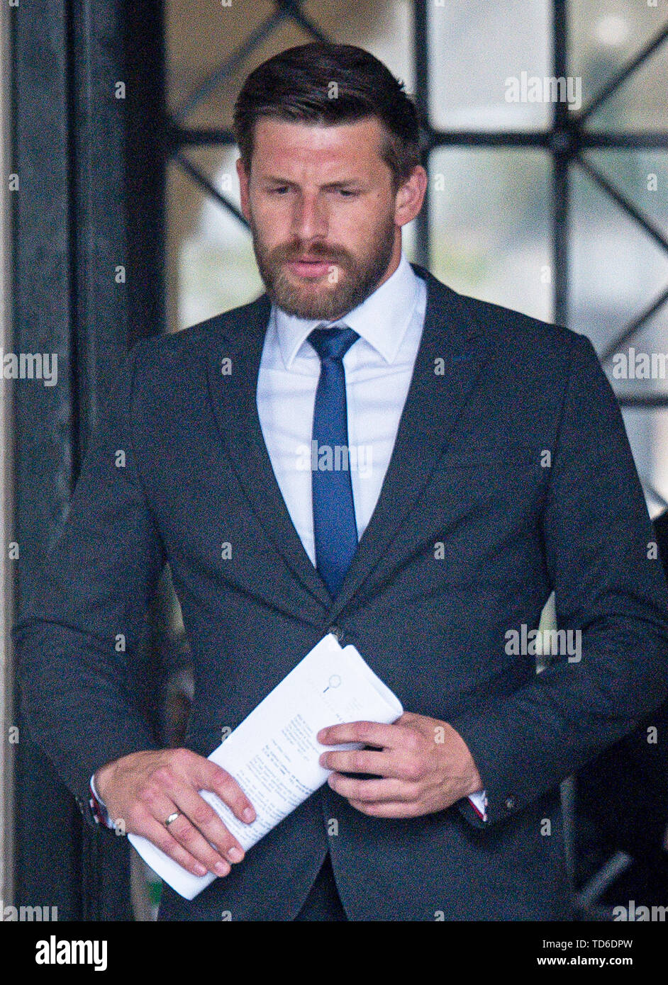 Gavin Collison, 34, leaves Nottingham Coroners Court during the inquest