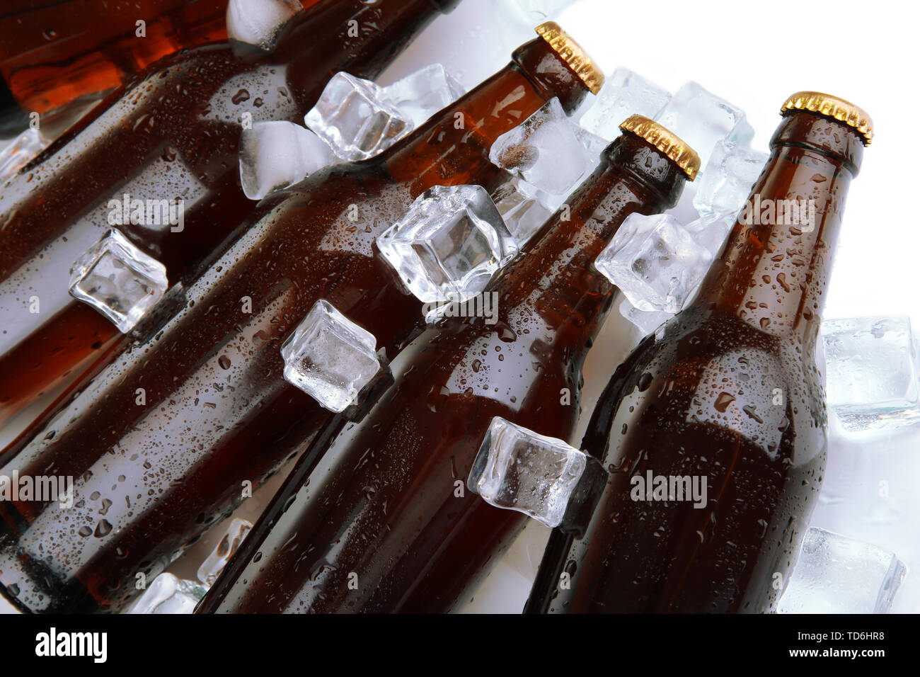 Beer bottles in ice cubes close up Stock Photo Alamy