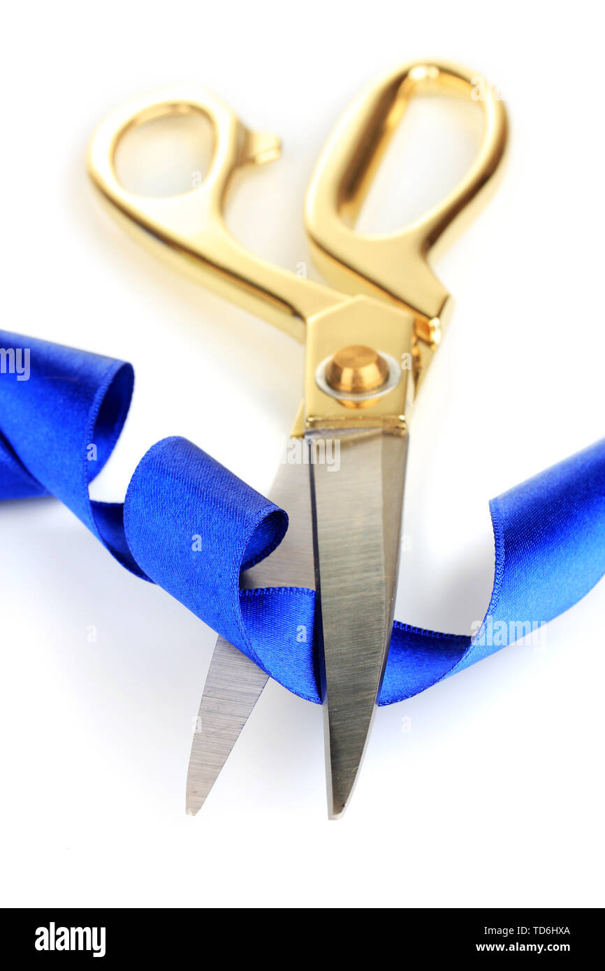 Satin ribbon curled around scissors isolated on white Stock Photo - Alamy