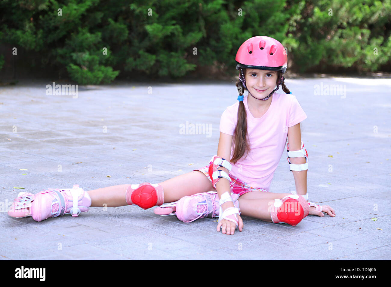 Little girl in roller skates at park Stock Photo Alamy