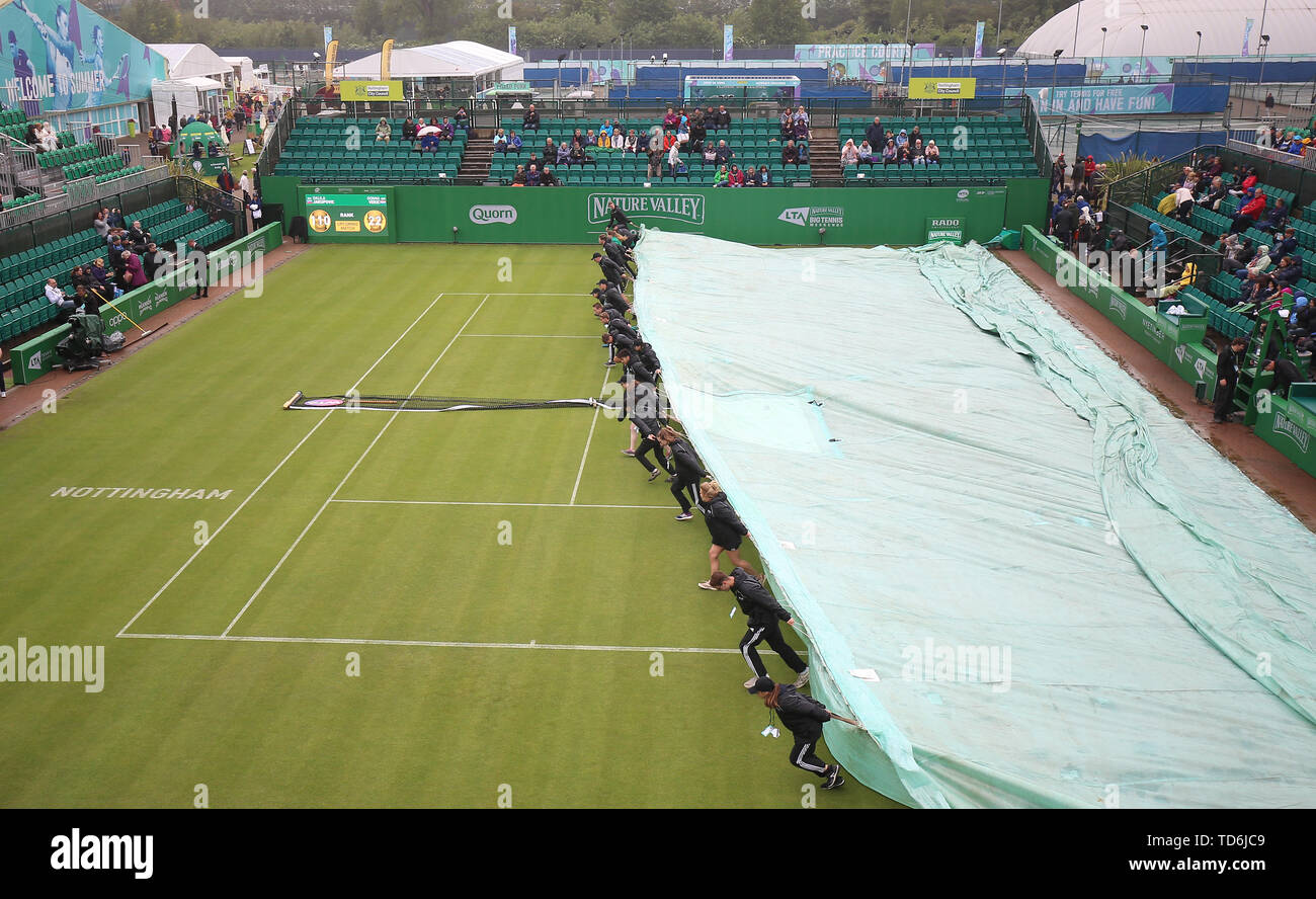 Ground staff cover centre court during day five of the Nature Valley
