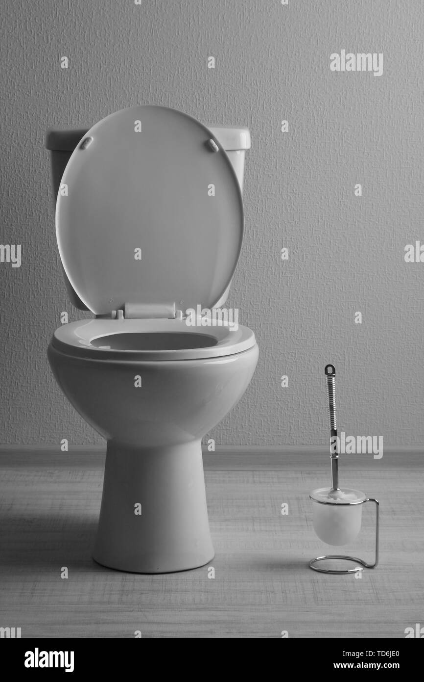 White toilet bowl in a bathroom Stock Photo - Alamy