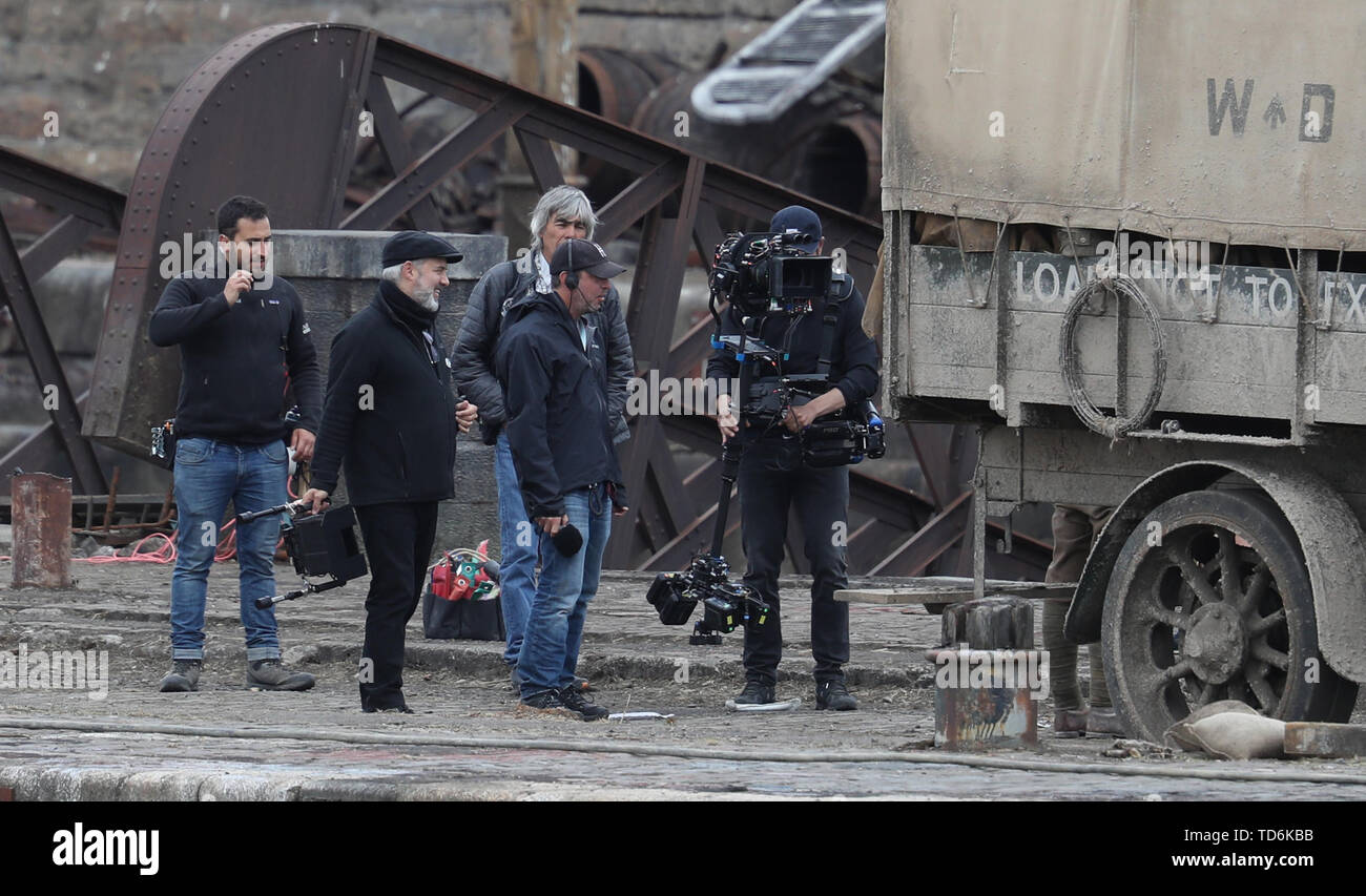 Director Sam Mendes (2nd left) on the set of his new film 1917 at Govan Docks in Glasgow. Stock Photo