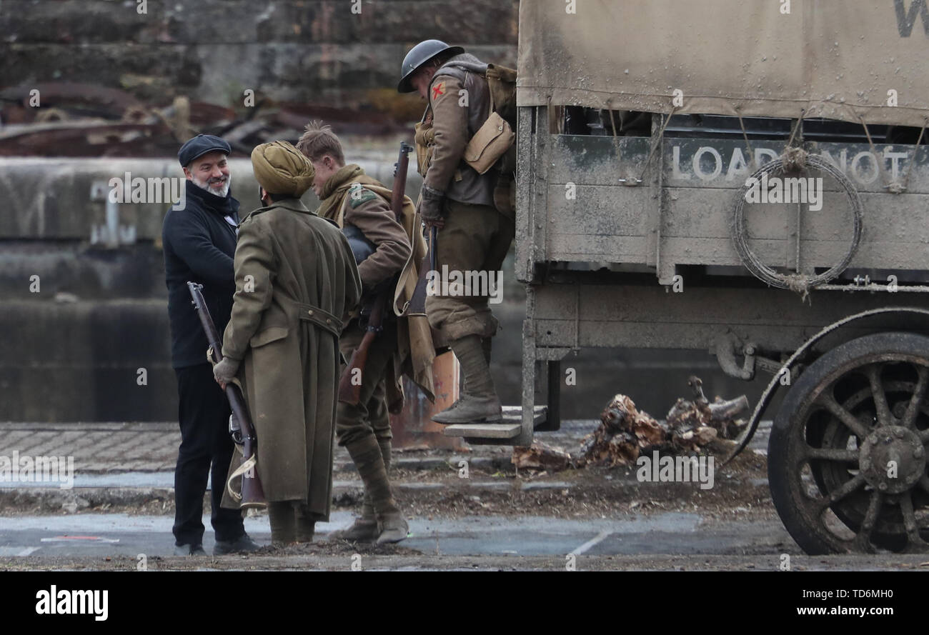 Director Sam Mendes (left) thanks cast members on the set of his new film 1917 at Govan Docks in Glasgow. Stock Photo