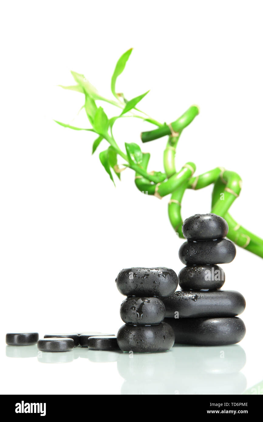 Spa stones and bamboo isolated on white Stock Photo - Alamy