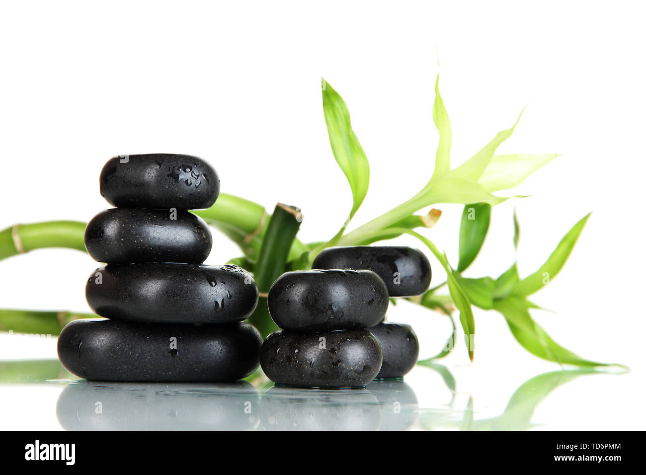 Spa stones and bamboo isolated on white Stock Photo - Alamy