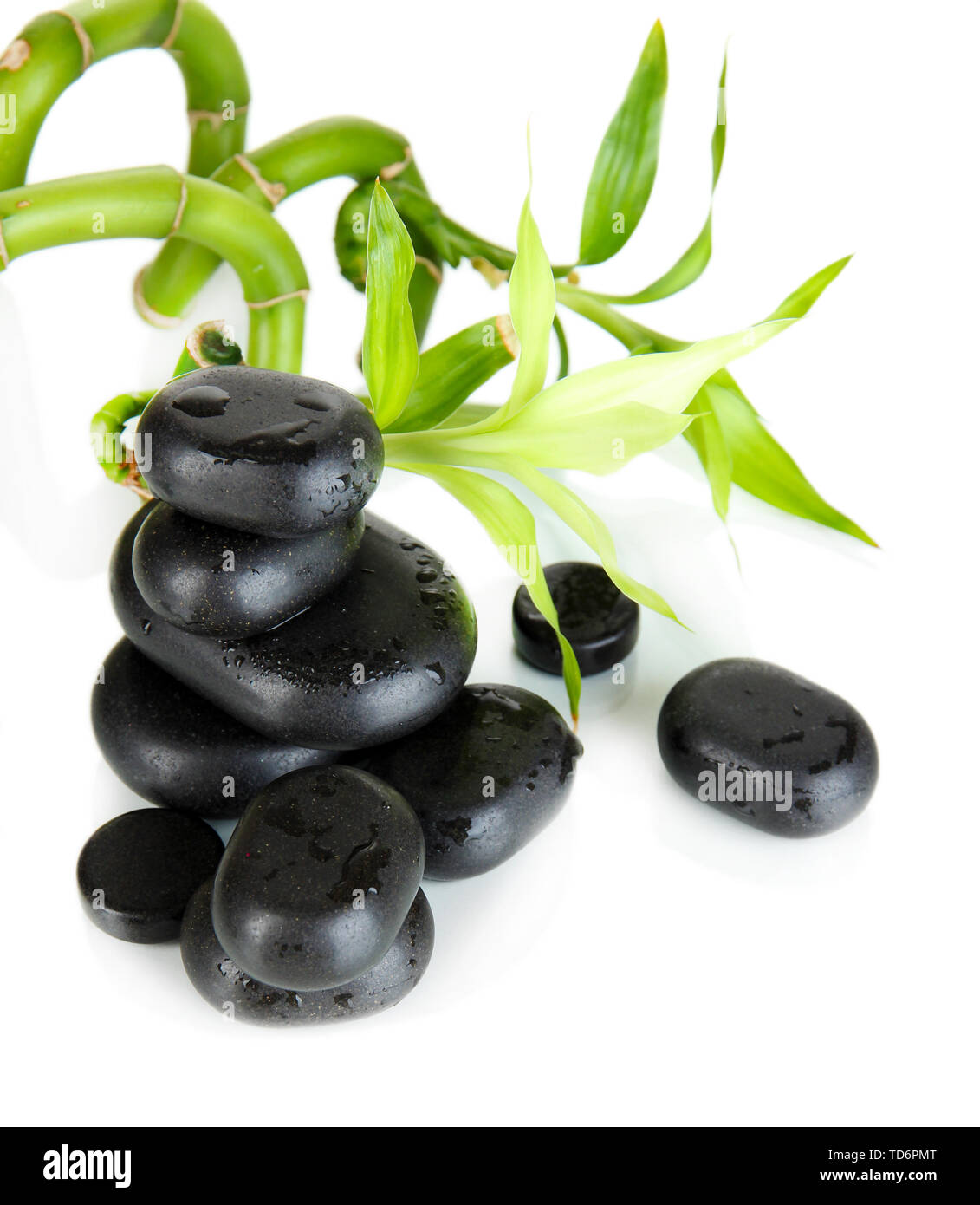 Spa stones and bamboo isolated on white Stock Photo - Alamy